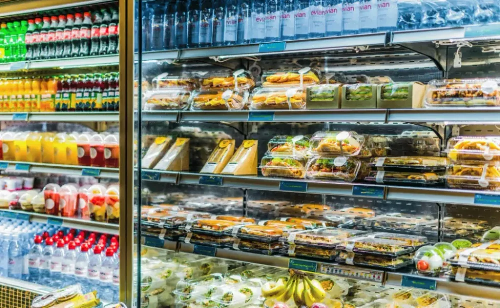 Pre-packaged foods displayed in a commercial refrigerator
